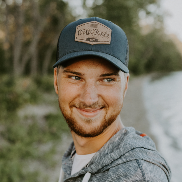 We The People Hat | Leather Patch Trucker Hat